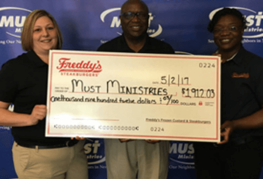 Freddy's presenting a donation to MUST Ministries