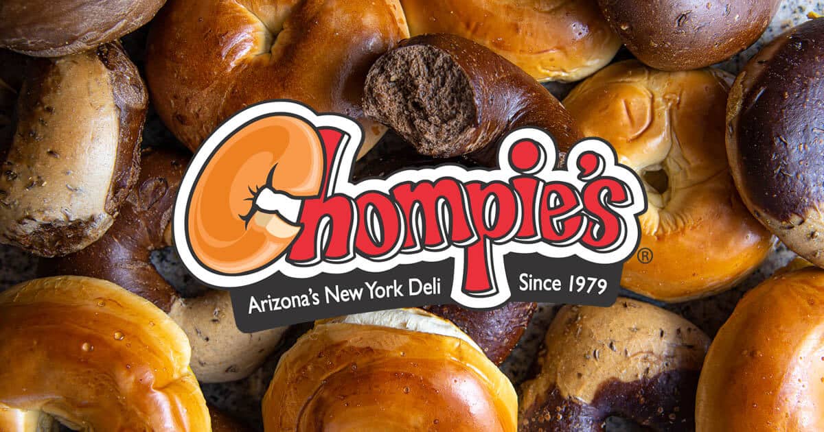 The Chompie's logo in front of a pile of Cragel Bagels